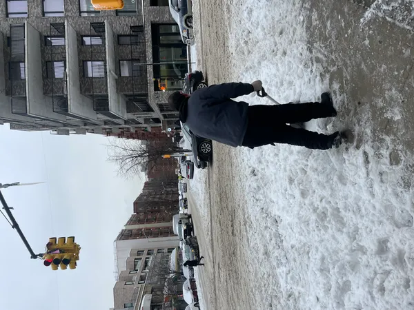 Columbus neighbors band together to free snowbound cars as historic storm strains local plowing capacity